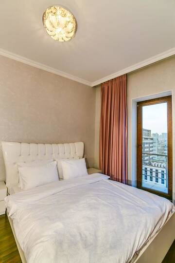 Фото номера Апартаменты с 3 спальнями Апартаменты Apartment on Tarqovu centr г. Баку 25