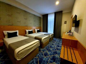Фото номера Трехместный номер Отель Porto Hotel Baku г. Баку 4