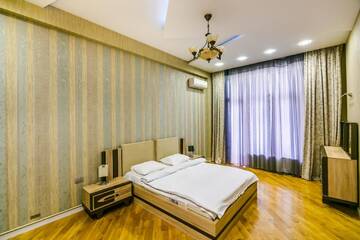 Фото номера Апартаменты Апартаменты Cozy Ferrari Apartment with full amenities by Time Group г. Баку 13