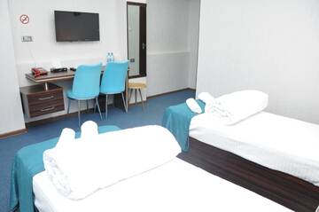 Фото номера Стандартный двухместный номер с 2 отдельными кроватями Отель Mildom Hotel Baku г. Баку 6