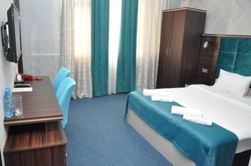 Фото номера Семейный номер с ванной комнатой Отель Mildom Hotel Baku г. Баку 6