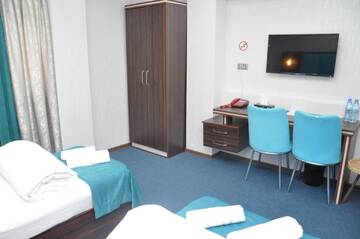 Фото номера Стандартный двухместный номер с 2 отдельными кроватями Отель Mildom Hotel Baku г. Баку 5