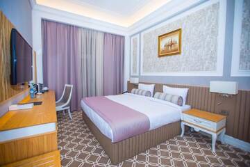 Фото номера Номер Делюкс с кроватью размера «king-size» Отель Theatrum Hotel Baku г. Баку 13