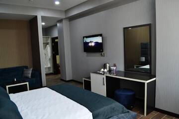 Фото номера Улучшенный двухместный номер с 1 кроватью Отель Supreme Hotel Baku г. Баку 3